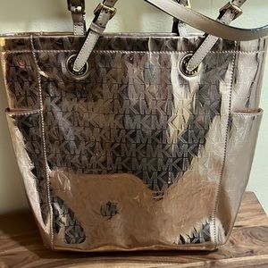 Never used rose gold tone Michael Kors handbag